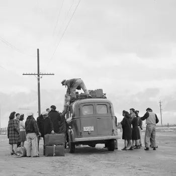 Internees wait to be trucked to the Manzanar War Relocation Center, in California.