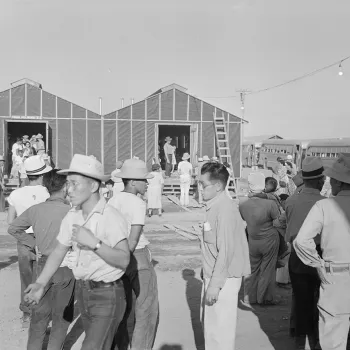 Newly arrived internees explore the Poston Center in Arizona in May 1942, while barracks were still under construction.