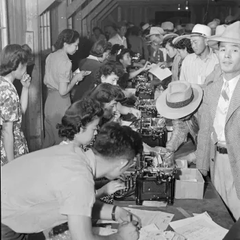 At Poston War Relocation Center, where future judge A. Wallace Tashima lived three years as a child, internees stand in registration line.