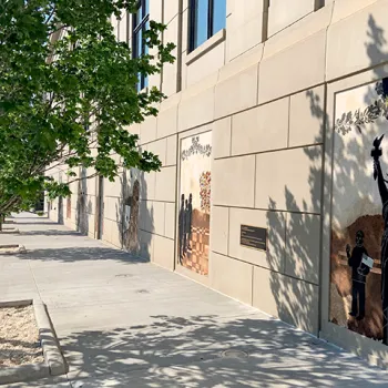 Exterior mosaics on the outside of the annex depict events that have occurred on the courthouse property. 