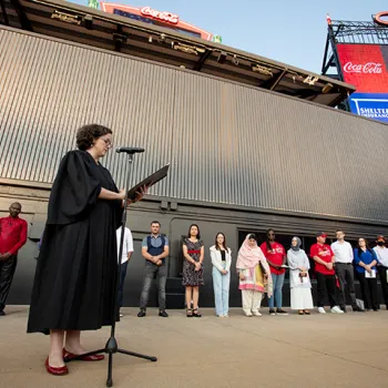 U.S. District Judge Sarah E. Pitlyk welcomes new citizens at Busch Stadium in St. Louis. Credit: St. Louis Cardinals.