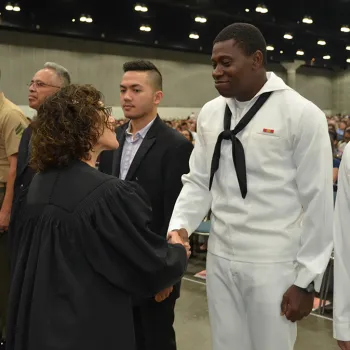 The federal court shakes hands with new citizens who serve in the military.