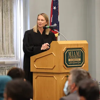 U.S. Magistrate Judge Stephanie K. Bowman welcomes new citizens at a naturalization ceremony at Miami University in Hamilton.