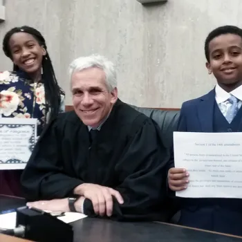 Students help at naturalization ceremony.