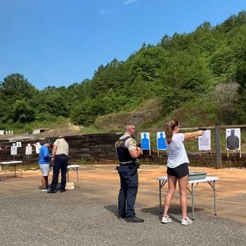 Image of interns at the firing range.