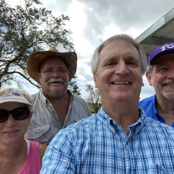 Chief Judge S. Maurice “Maury” Hicks after delivering an electrical generator and relief supplies purchased through court staff donations. Also in photo are Court Security Officer Malcom Hebert and his wife, Laurie, foreground, whose