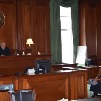 U.S. District Judge P. Kevin Castel presided over a time-sensitive international abduction case in the Moynihan Courthouse, which lost power due to the storm, using a temporary table lamp and natural sunlight to light the courtroom.