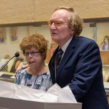 U.S. District Judge Donovan W. Frank, right, and Karen Loven, an advocate for disability rights, discuss the achievements made in the law for those with developmental disabilities during a public reception at the Minneapolis federal courthouse.