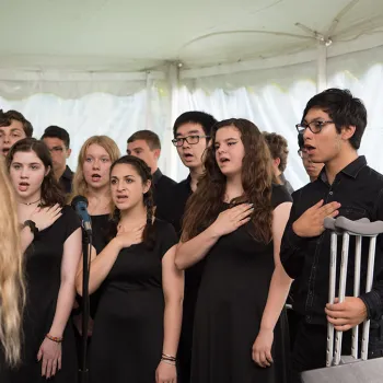 Students sing the National Anthem at a naturalization ceremony in Oyster Bay, NY.