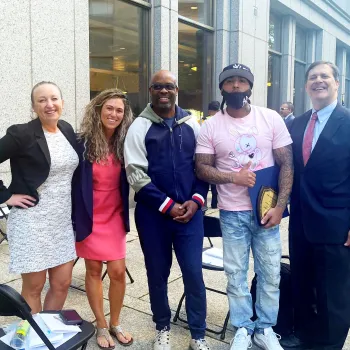 From left to right, Probation Officers Elisha Rivera and Lauren Blackford, RISE Court graduates Michael Lewis and Vincent Hernandez, and Magistrate Judge James L. Cott, of the Southern District of New York.