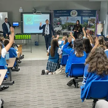 Image: Probation officers in Puerto Rico discuss probation's role in the courts with students.