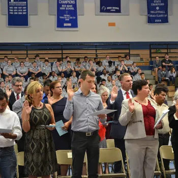 New citizens say the Pledge of Allegiance. 