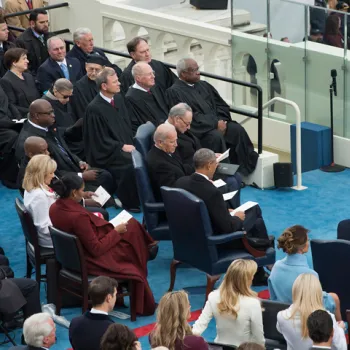 U.S. Supreme Court justices seated on the presidential platform.