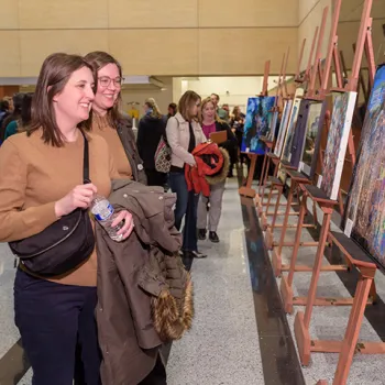 VIsitors admire pieces created by artists with developmental disabilities during a public reception at the federal courthouse in Minneapolis.