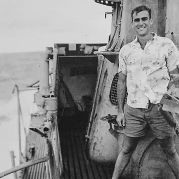 Navy Lt. Jack B. Weinstein stands on the deck of the submarine USS Jalloa, in the Pacific theater.