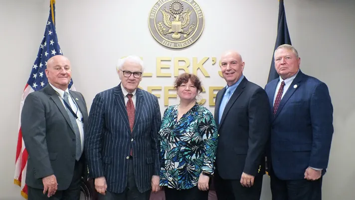 Photograph of five employees of the Fifth Circuit Court of Appeals.