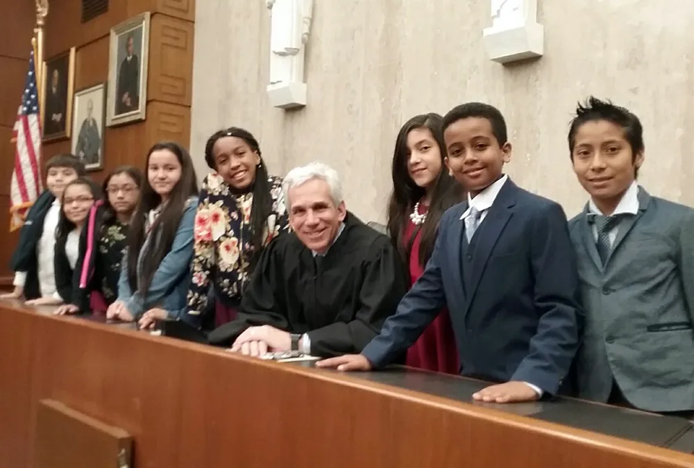 Students help at naturalization ceremony.