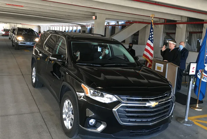 Image of a drive-through naturalization ceremony