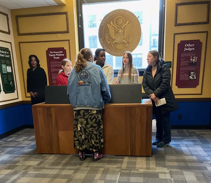 Visitors view exhibits at the new learning center at the federal courthouse in Indianapolis.