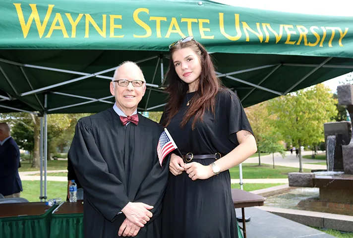 U.S. District Court Judge Mark A. Goldsmith with new citizen Xenya Burdo.