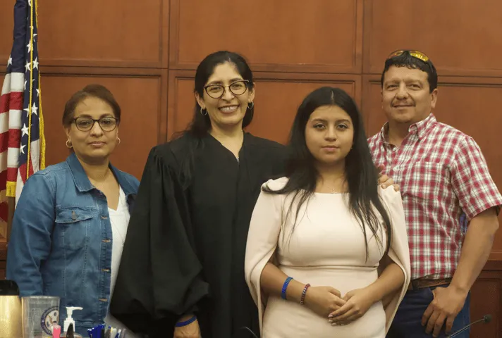 U.S. District Judge Diana Saldaña welcomes Kazen Fellow Odete Coss and her parents at the federal courthouse in Laredo, Texas.