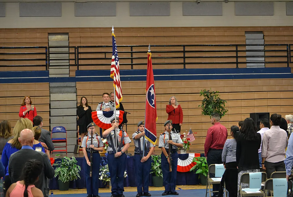 Students help at naturalization ceremony.